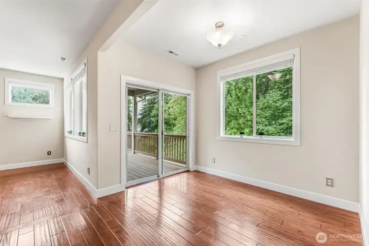Dining  opens onto to covered deck to extend living outdoors.