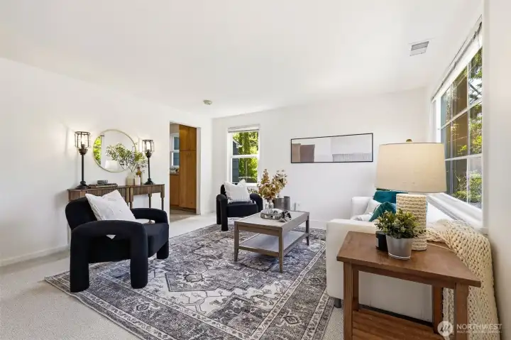 Another view of the bright front living room and open flow