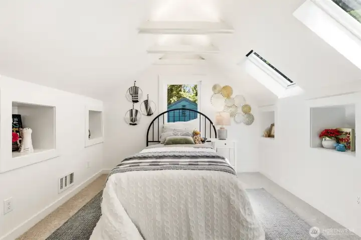 Upstairs bedroom with cozy angles and great natural light