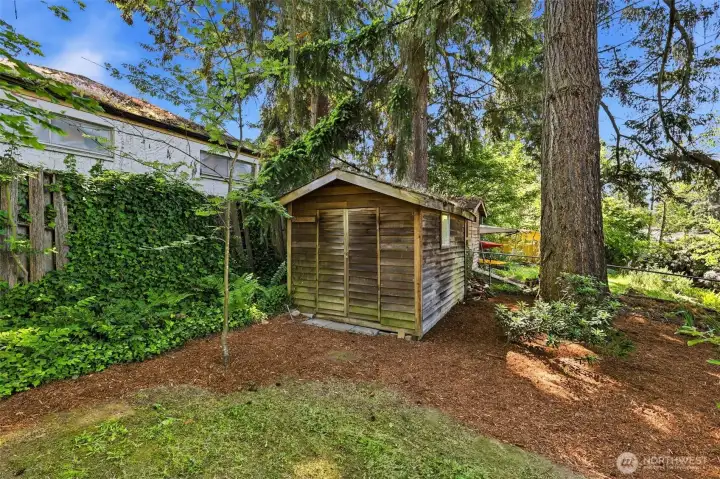 Detached outbuilding offers added storage and flexible utility
