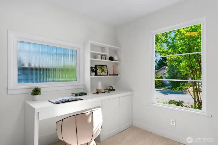 Built in desk with lush picture window Built in desk with lush picture window