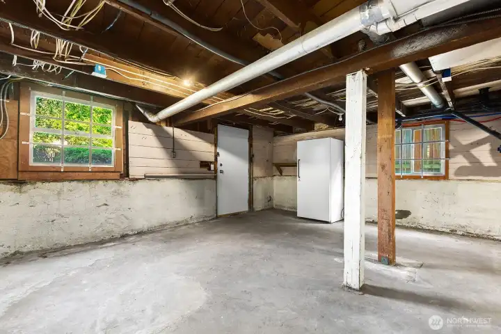 Basement us unfinished with W/D + Utilities - Tankless H20 & Gas Furnace. New exterior door exits to the backyard Basement us unfinished with W/D + Utilities - Tankless H20 & Gas Furnace. New exterior door exits to the backyard