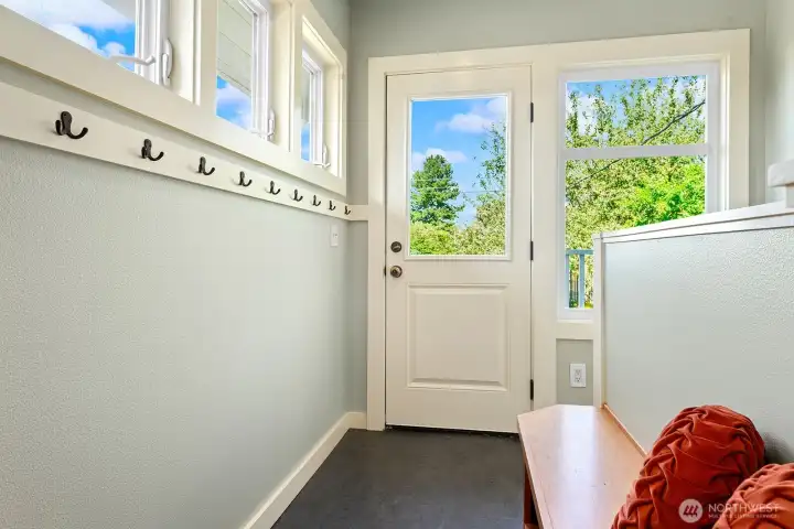 Back door mud room and stairs to basement Back door mud room and stairs to basement