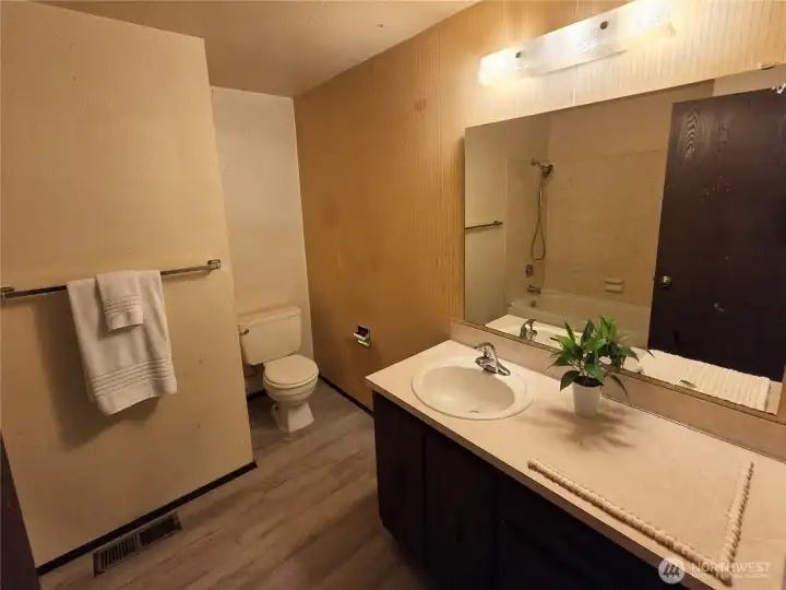 The bathroom is on the upper level.