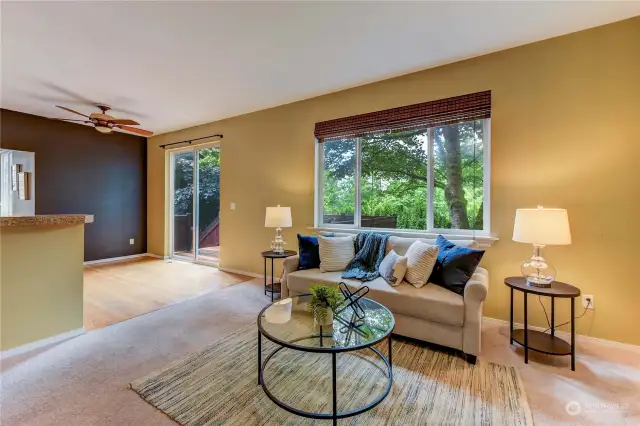 Family room has a large window that overlooks the backyard.