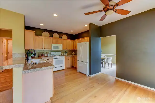 The kitchen is the heart of the home and is centrally located between the Formal Dining Room and the Family room.