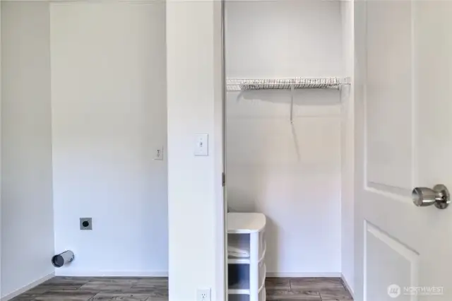 Closet in bedroom with shelves