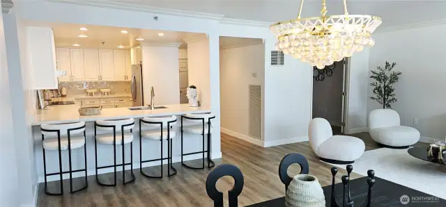 View of living room, kitchen and den