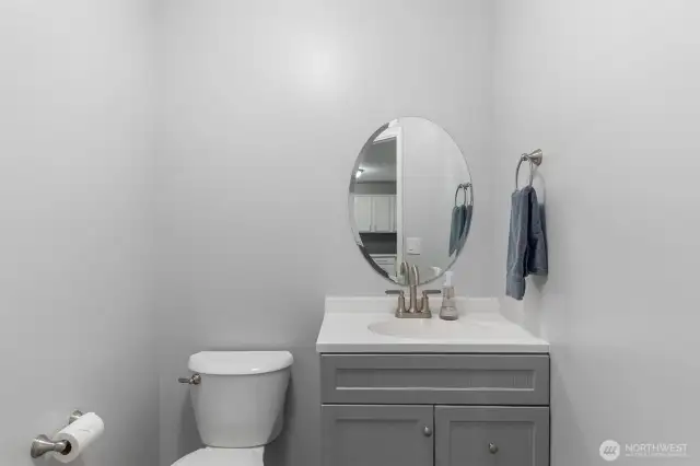 Convenient main floor powder room with newer vanity and toilet