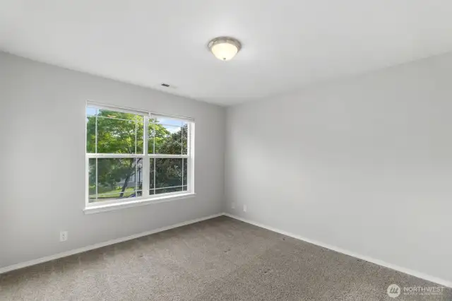 Bedroom number one at the front of the house. New carpet throughout.