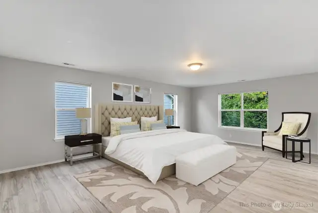 We saved the best for last....the primary suite is absolutely massive! There is room for your furnishing and more! Shown virtually staged here.