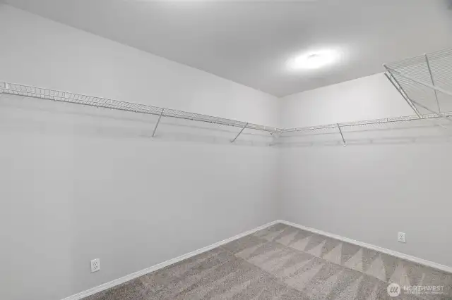 Check out this amazing primary closet! It measures 7.7' x 13.6'!