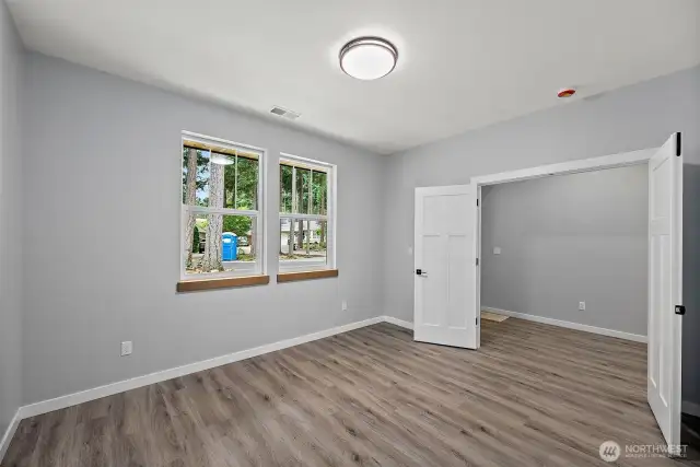 An Interior View of the Main Floor Flex Room. Dual Entry Doors - Ideal Guest Bdrm or Home Office!