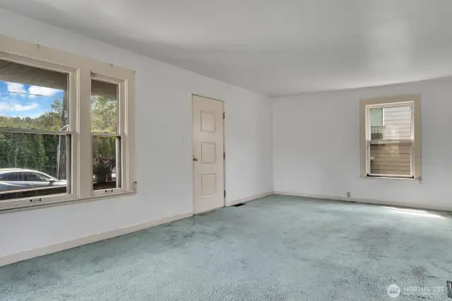 You enter into the south facing living room.