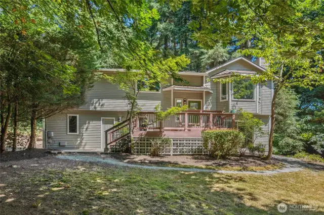 Surrounded by green and beauty, this home offers privacy and abundant natural light!