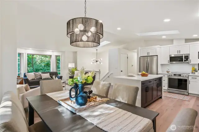 Vaulted ceilings and LVP flooring throughout the main level living spaces.