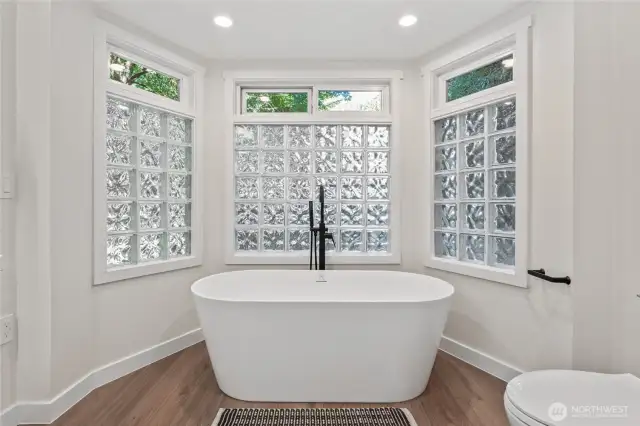 Updated main floor guest bath with beautiful, stand alone soaking tub!