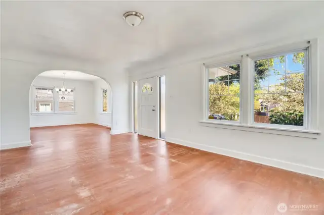Period features like arches, coved ceilings, and hardwood floors give you tools for restoration. Bonus: Newer windows throughout.