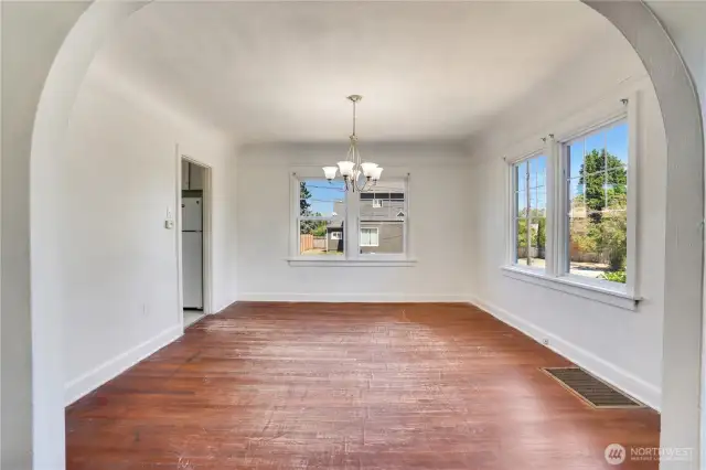 The dining room is open to the galley kitchen with a sunny kitchen eating area.