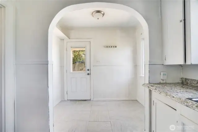 Perfect eating nook and/or build in some cabinets to hang coats and backpacks.
