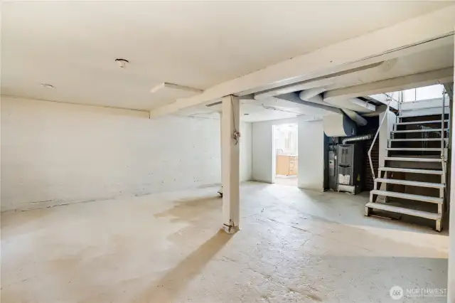 Basement has a 3/4 bath, tons of recreation space, another studio room and access to the garage.