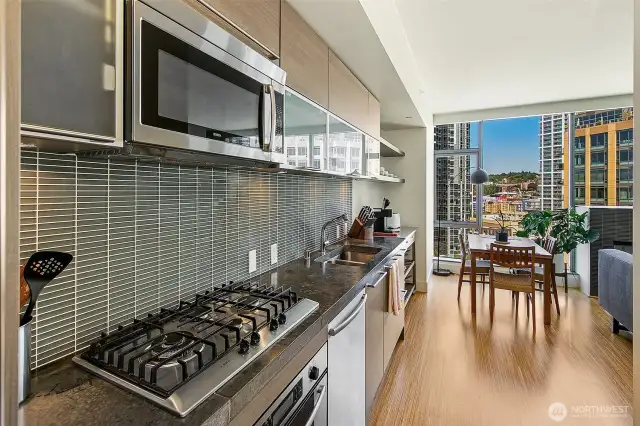 Efficient and high quality kitchen with eggersman cabinetry, glass backsplash, gas cooking and great function.