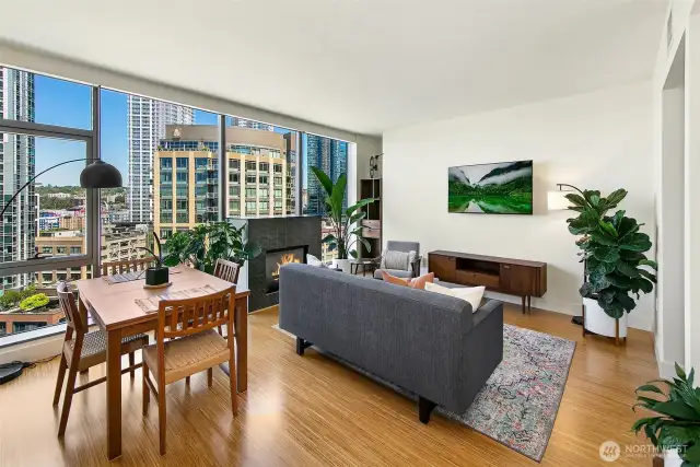 Full wall of floor to ceiling windows showcase the best perspective of lake union.