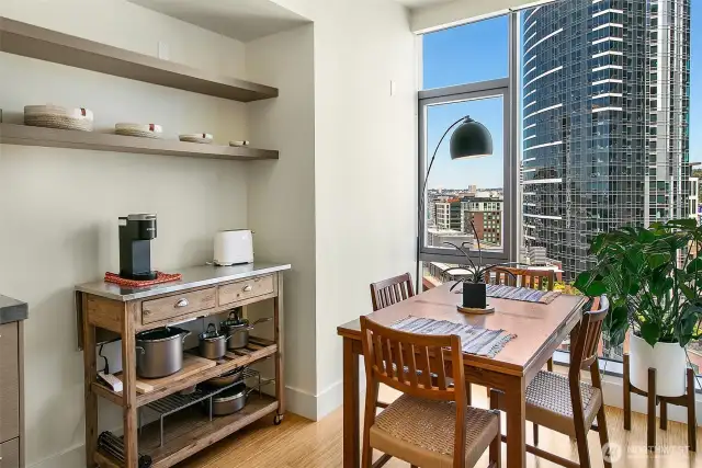 Full wall of floor to ceiling windows showcase the best perspective of lake union.