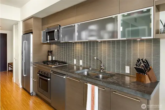 Efficient and high quality kitchen with eggersman cabinetry, glass backsplash, gas cooking and great function.