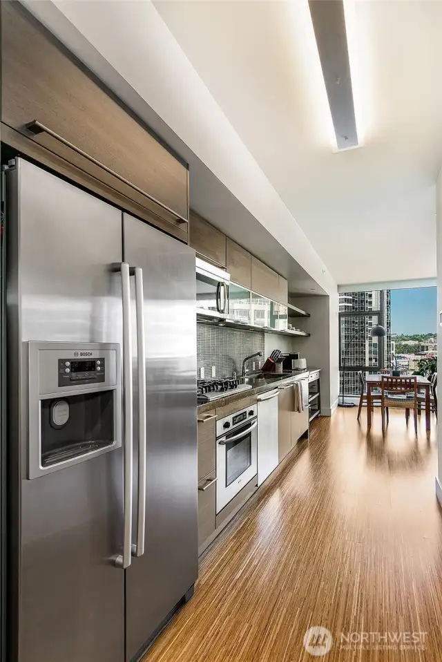 Efficient kitchen has full size appliances and plenty of quality storage.