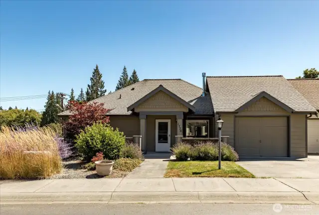 Private end unit with attached single car garage.