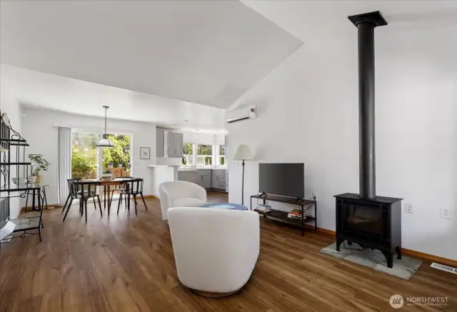 Sunlight floods this airy, open-concept living room, where clean lines and fresh tones create a serene, welcoming space