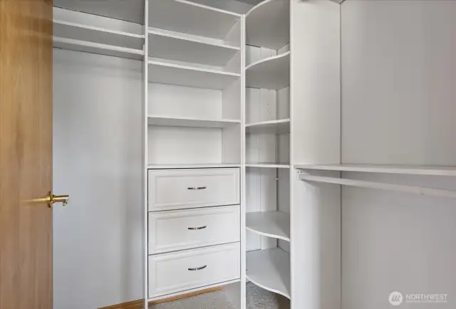 Updated primary closet with drawers and shelves to keep things neatly organized and easy to find.