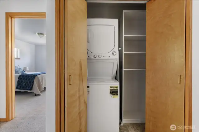 Stacked laundry set tucked neatly in a closet for a clean, streamlined look.