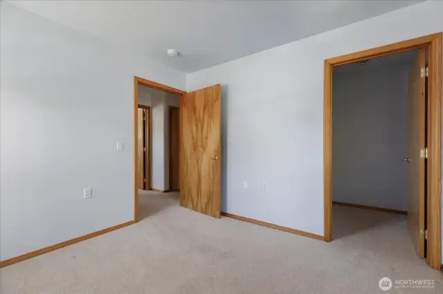 Spacious guest room with a generous walk-in closet to keep belongings neatly tucked away.