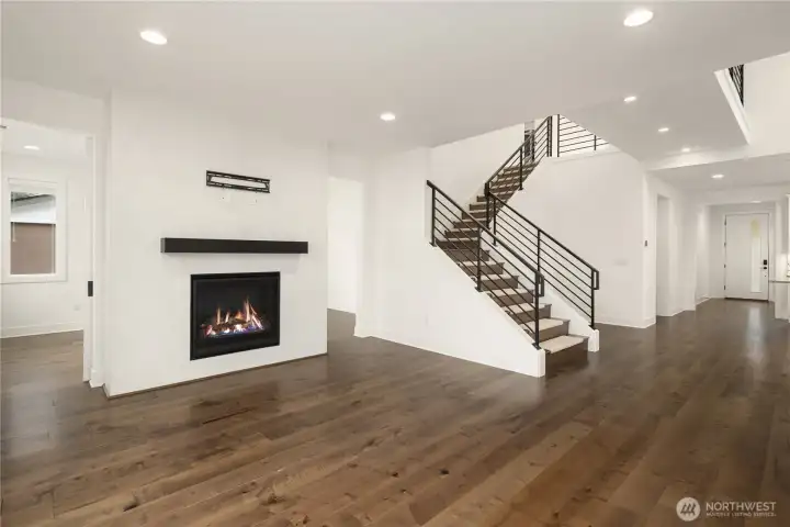 Living room with TV mount overlooking to upstairs