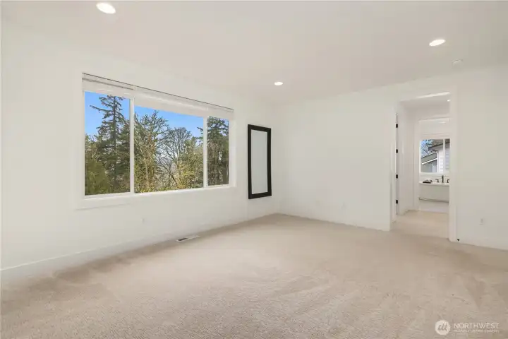 Primary bedroom with bathroom suite