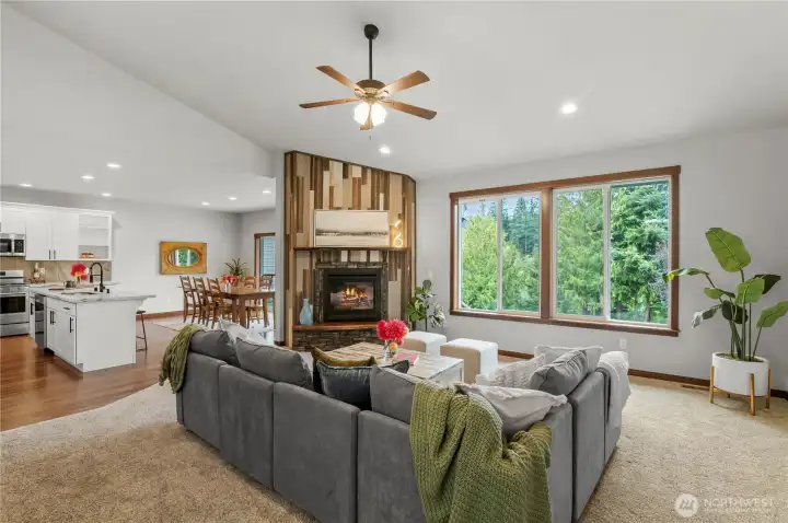 Expansive living space with soaring ceilings, yet cozy with gas fireplace.