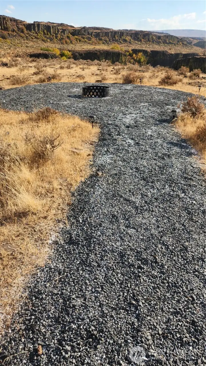 End of walkway with firepit. Walk to the end for the amazing views into the canyons and down to the Palisades.