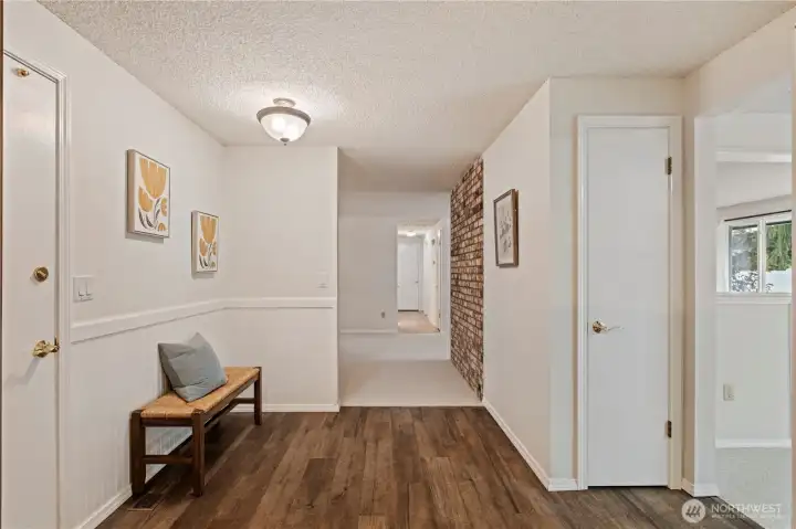 Entry to kitchen from garage on left. Add a table for shopping bags, and access to pantry closet in kitchen.
