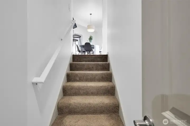 Staircase connects the home’s levels with a bright, open feel.