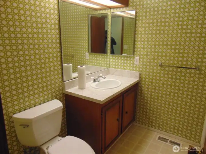 One of the 2 full bathrooms on the main floor .