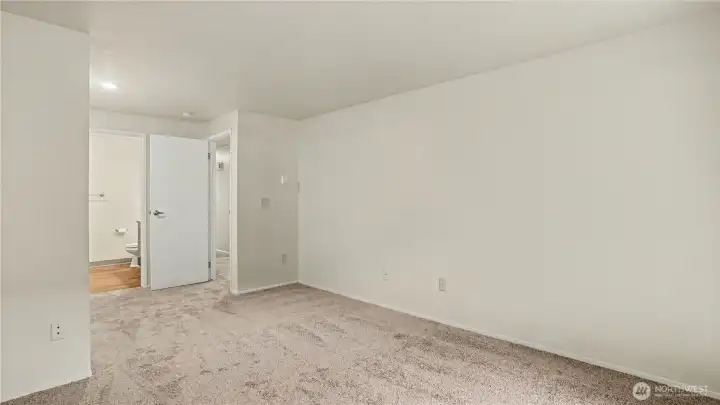 Another angle of your Primary Suite showcasing the abundance of natural light that beams into this space.