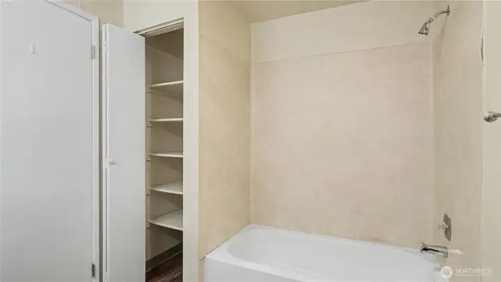Another view of the full bathroom with clever closet space.