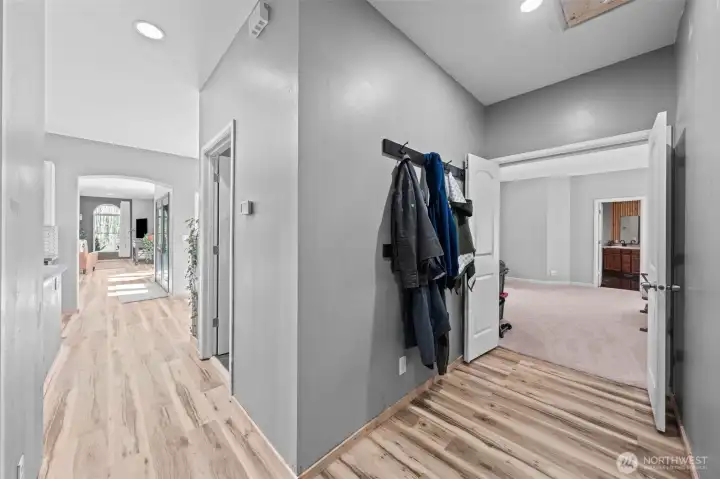 Hallway to front of house and hall to Primary bed room