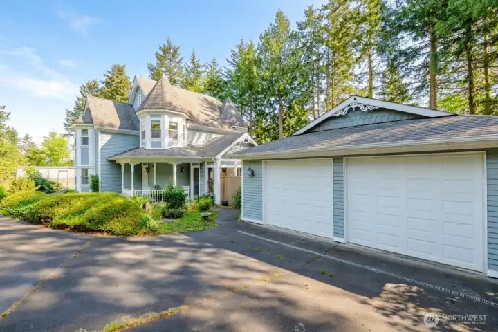 An oversized detached garage, expansive driveway, and enchanting architecture offer the perfect blend of beauty, function, and everyday convenience. An oversized detached garage, expansive driveway, and enchanting architecture offer the perfect blend of beauty, function, and everyday convenience.