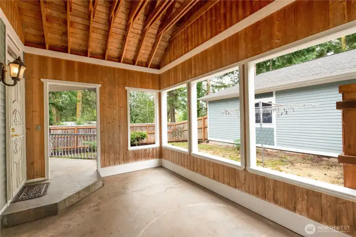 A charming enclosed sun porch extends your living space. A charming enclosed sun porch extends your living space.