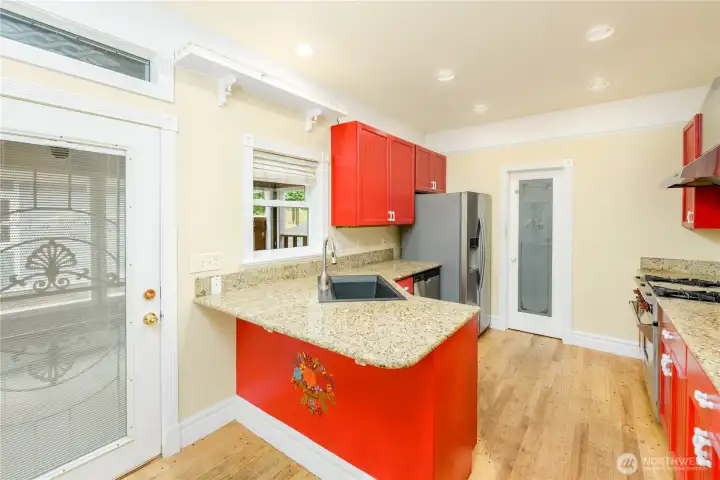 A cheerful chef's kitchen blends timeless character with modern updates, featuring granite countertops, stainless steel appliances, and generous prep space for everyday living and entertaining. A cheerful chef's kitchen blends timeless character with modern updates, featuring granite countertops, stainless steel appliances, and generous prep space for everyday living and entertaining.