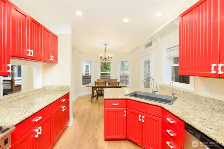 A bright, beautifully updated kitchen with granite countertops, abundant workspace, and an inviting dining nook makes every meal feel like a special occasion. A bright, beautifully updated kitchen with granite countertops, abundant workspace, and an inviting dining nook makes every meal feel like a special occasion.