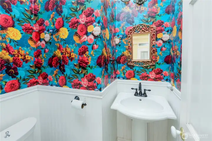 A stunning designer half bath makes a memorable statement with bold floral wallpaper, classic beadboard wainscoting, and timeless charm your guests won't forget A stunning designer half bath makes a memorable statement with bold floral wallpaper, classic beadboard wainscoting, and timeless charm your guests won't forget
